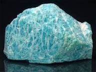 Blue-green Amazonite specimen showing pale Feldspar streaks and subtle shimmer