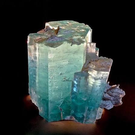 Clear blue Aquamarine Beryl crystal showing pale sea-blue colour and natural inclusions