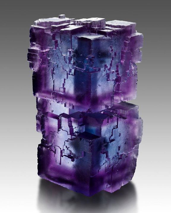 Rainbow-banded Fluorite crystal showing vivid purple, green, blue and clear cubic zoning