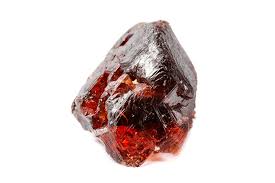 Raw deep red Garnet crystal with vitreous lustre displaying natural faceted form against a white background