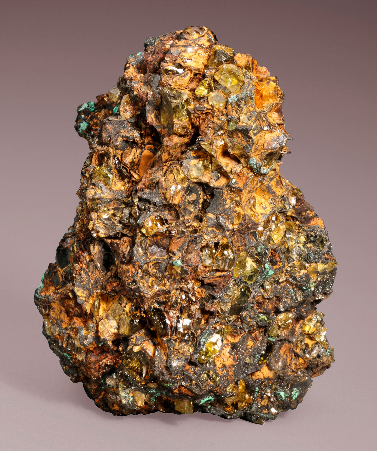 Pallasite meteorite showing green Olivine crystals in an Iron-Nickel matrix
