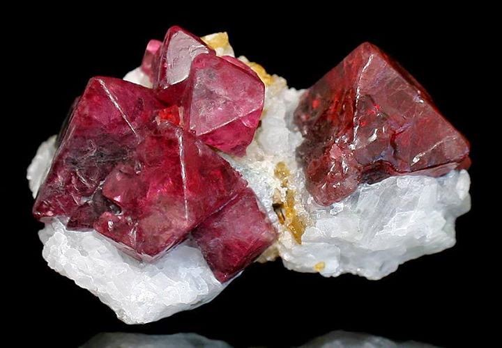 Natural Spinel gemstone showing deep black colour with a glossy reflective polished surface
