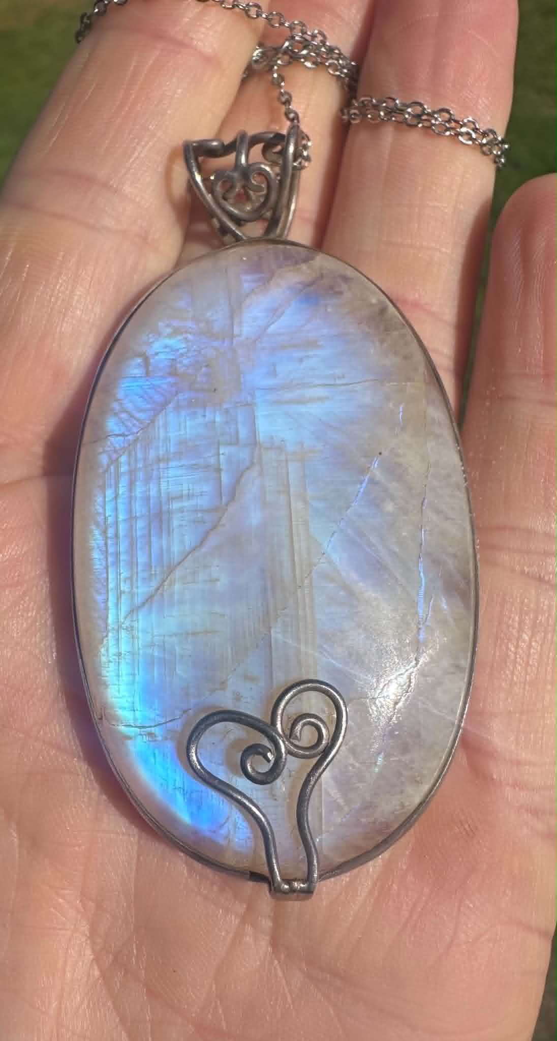 Rainbow moonstone pendant representing the beginning of Cheree’s crystal journey