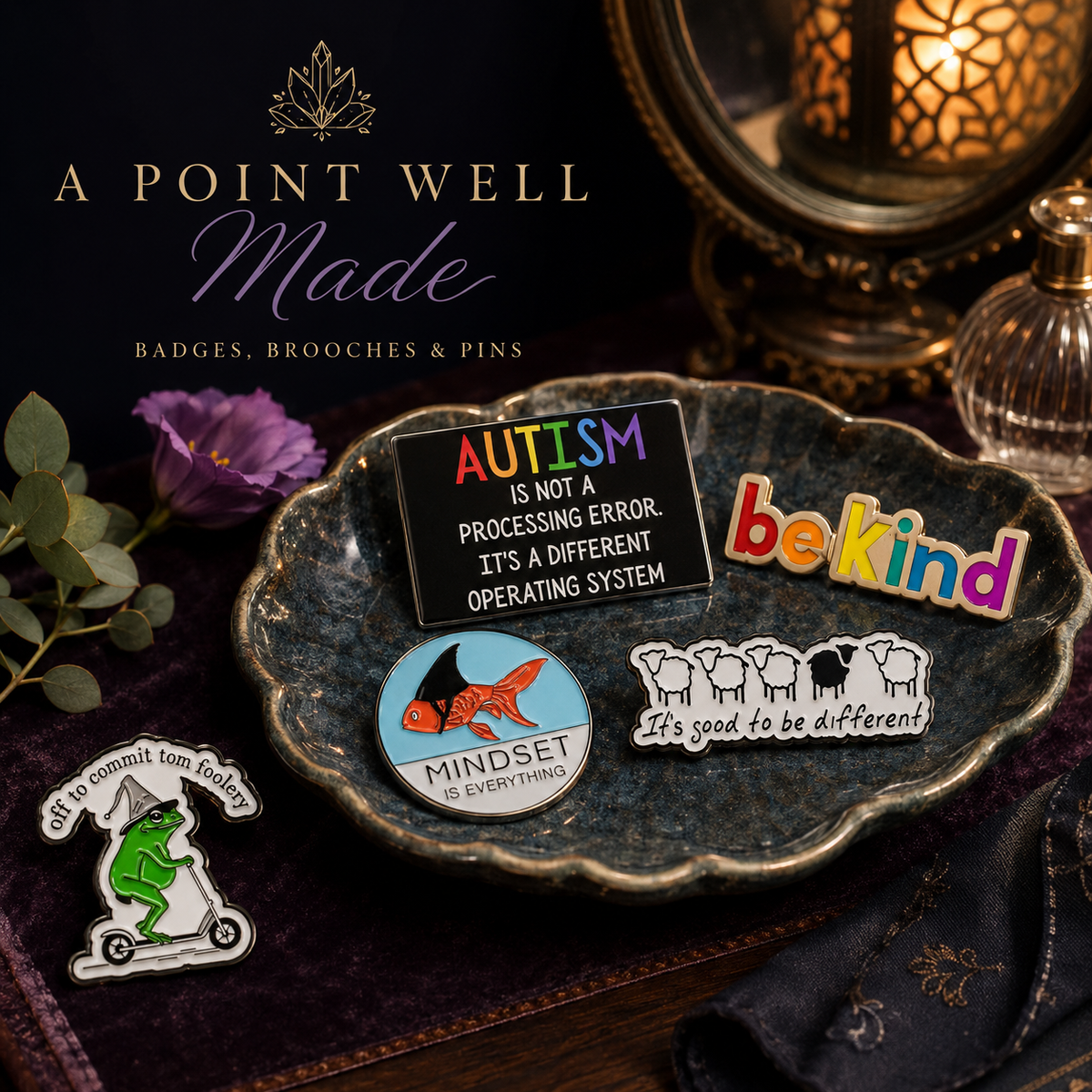 A Point Well Made collection - enamel pins and badges including be kind, autism awareness and mindset pins displayed on a decorative dish